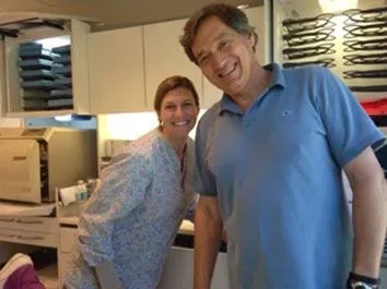 Dr. Bandoni and his wife Mary working together inside the dental office